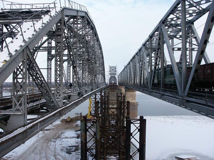 Способ реконструкции моста через водную преграду